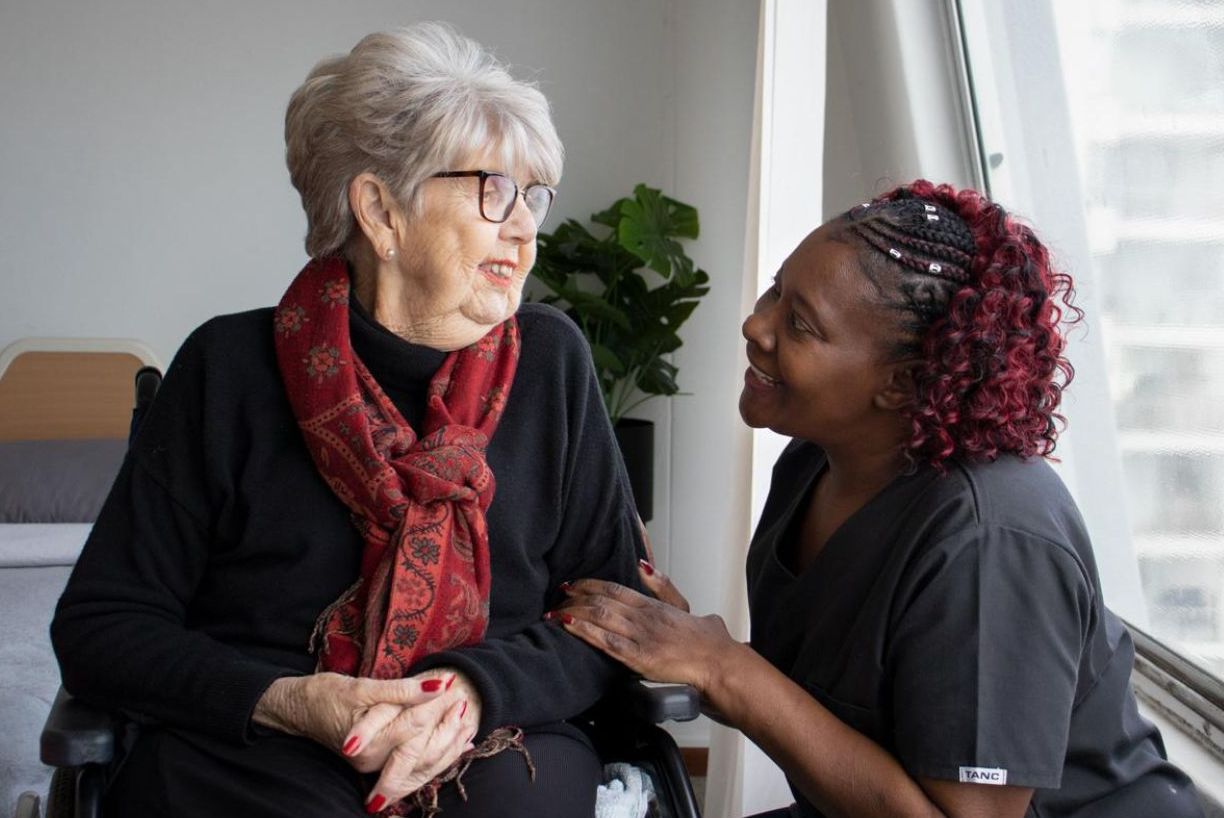 Peniel Care support worker with client